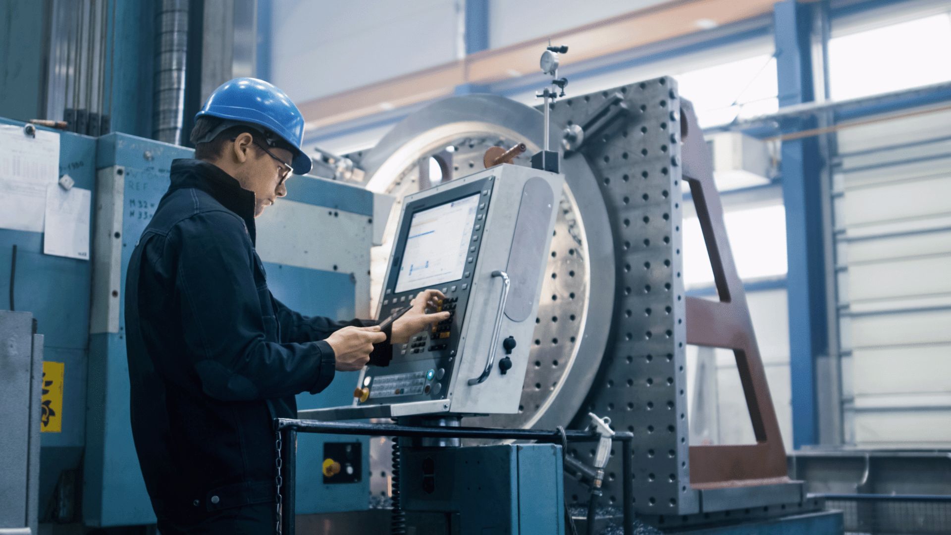Engineer programming a CNC machine