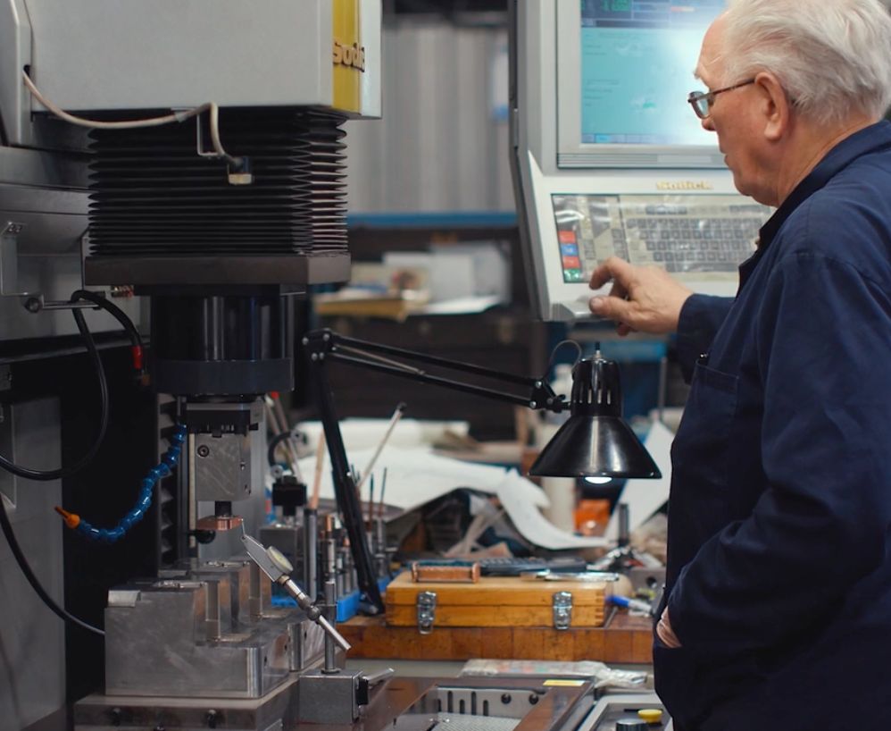 Sinker EDM machine burning a tool component